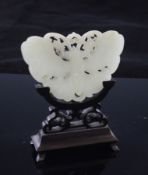 A Chinese pale celadon jade `butterfly` plaque, 19th century, carved and pierced, with a ruyi head