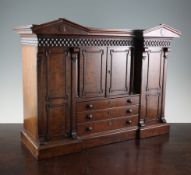 A Victorian mahogany miniature Beaconsfield wardrobe, with moulded cornice over four doors and three