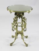 A late 19th century gilt bronze circular lamp table, the pierced table in the Chinese manner, with