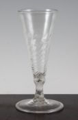 A wrythen moulded ale glass, c.1730, with conical folded foot, 6.25in.