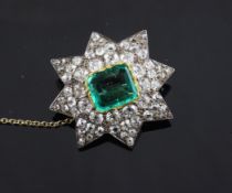 An Edwardian emerald and diamond set star brooch, set with rectangular emerald border by old cut