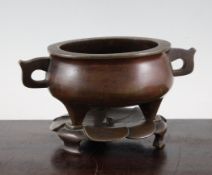 A Chinese bronze censer and stand, Xuande six character seal mark but later, the squat baluster