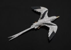 A cased 1990`s 18ct two colour gold and diamond set bird brooch, modelled as a frigate, 3in.