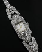 A lady`s 1940`s platinum and diamond set cocktail watch, with rectangular dial with baton