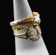 Three early 20th century 18ct gold and diamond set dress rings, solitaire, lozenge, and horseshoe,