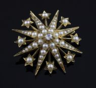 A late Victorian gold, seed pearl and diamond set starburst pendant brooch, maker`s mark A.A. over