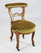 A 19th century French tulipwood prie dieu chair, with brass beading, with shaped upholstered top