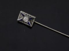 An early 20th century white gold, diamond and sapphire set stick pin, with rectangular pierced