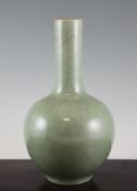 A Chinese celadon glazed bottle vase, 20th century, with crackle glaze, 11.5in. (29.2cm)