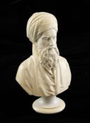 A 19th century carved ivory bust of a Turk, with a long beard and turban, on circular socle base,