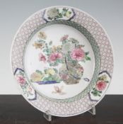 A fine Chinese famille rose ruby-backed `flower basket` dish, Yongzheng period, of semi-egg shell