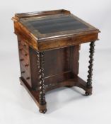 A Victorian rosewood davenport, with maple lined interior and four side drawers, 2ft 1in.