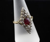 An 18ct gold ruby and diamond set marquise shaped cluster ring, size O.