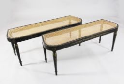 A pair of Regency painted beech window seats, with harebell decoration on a black ground, 2ft 9in.