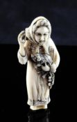 A Japanese ivory netsuke of a European lady holding an animal, early 20th century, two character