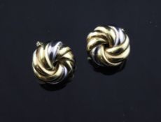 A pair of 18ct two colour gold ear clips, of whorl design.