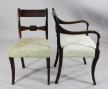 A set of eight Regency mahogany dining chairs, including two carvers, with tablet cresting rails,