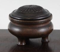 A Chinese bronze ding-shaped censer, the compressed globular body with three swept stump feet,