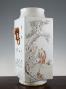 A Chinese Cong shaped vase, painted with scholars examining a scroll and a bird perched on a branch,