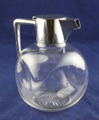 A late Victorian plain silver mounted glass claret jug by Hukin & Heath, with dimpled glass body,