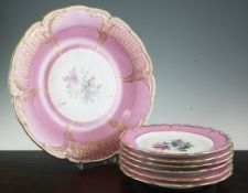 A Berlin KPM pink ground gilt-decorated charger and six similar later dessert plates, 19th/20th