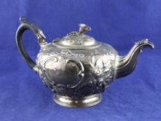 A George III silver teapot by Peter & William Bateman, with later floral embossed decoration, of