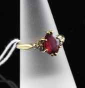 An 18ct gold, rubellite tourmaline and diamond set ring, with oval cut tourmaline and diamond set