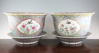 A pair of Chinese famille rose jardinieres and stands, late 19th century, each painted with crows