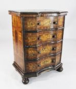 An 18th century Italian walnut and marquetry serpentine commode, with crossbanded top and four