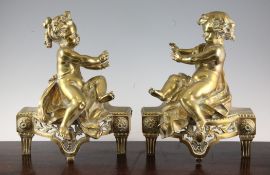 A pair of 19th century French ormolu chenets, modelled as children warming their hands, 12in.