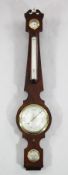 F. Amadio & Son., London. A Regency flame mahogany wheel barometer, of slender proportions, with