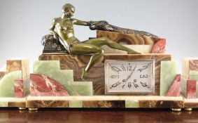 An Art Deco bronzed spelter and marble clock garniture, surmounted with a maiden carressing a