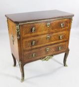 A French transitional style kingwood and ormolu mounted marble top commode, with three drawers, on