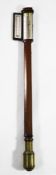 Troughton, London. A Regency mahogany stick barometer, with enclosed silvered scale and thermometer,