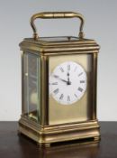 A Drocourt gilt brass quarter repeating grand sonnerie carriage clock, with enamelled Roman dial and