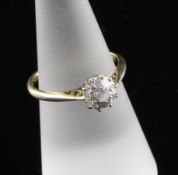 An 18ct gold and solitaire diamond ring, the stone weighing approximately 1.20ct, size M.