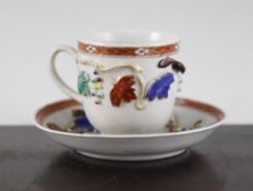 A Chinese export famille rose coffee cup and saucer, Qianlong period, with applied fruiting vine and