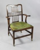 A Northern English George III mahogany elbow chair, with spindle back and drop in seat, on squared