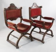 A pair of late Victorian walnut X frame open armchairs, the part upholstered back with fan shaped