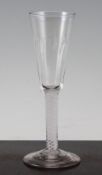 An opaque twist stem ratafia glass, c.1765, the ribbed conical bowl above four opaque corkscrew