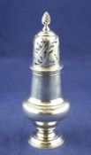 An early George III silver caster, of baluster form, with spiral finial, John Delmester, London,