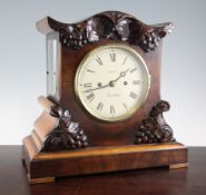 A Victorian mahogany mantel clock, with vineous carved case and later painted dial signed Foorde,