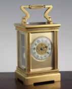 An early 20th century French gilt brass hour repeating carriage clock, with blind fret work