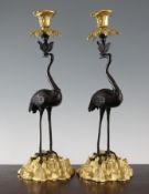 A pair of French bronze and ormolu candlesticks, modelled as Japanese cranes, 16in.