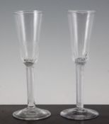 A pair of George II airtwist ale glasses, c.1750, with slender fluted bowls on plain airtwist