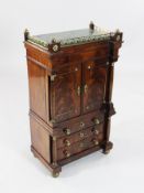 An early 19th century Dutch miniature mahogany cabinet, with brass galleried green marble top over