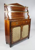 A Regency mahogany secretaire chiffonier, with brass galleried shelves, fall front drawer