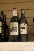Five bottles including two Domaine de Chevalier rouge 1976, Graves, both upper shoulder, one very