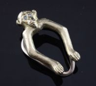 An early 1970`s novelty 9ct gold and opal set money clip in the form of a monkey, by Alfred Dunhill,