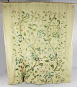 A 19th century crewel work wall hanging, decorated with birds among flowering branches and